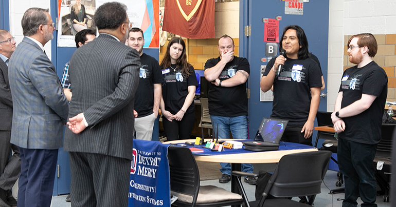 Students from cybersecurity club presenting to local politicians and experts