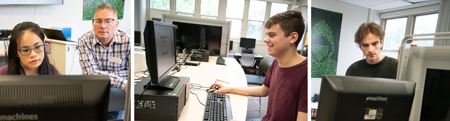 Students with professor Gregory Laidlaw working on computers in lab