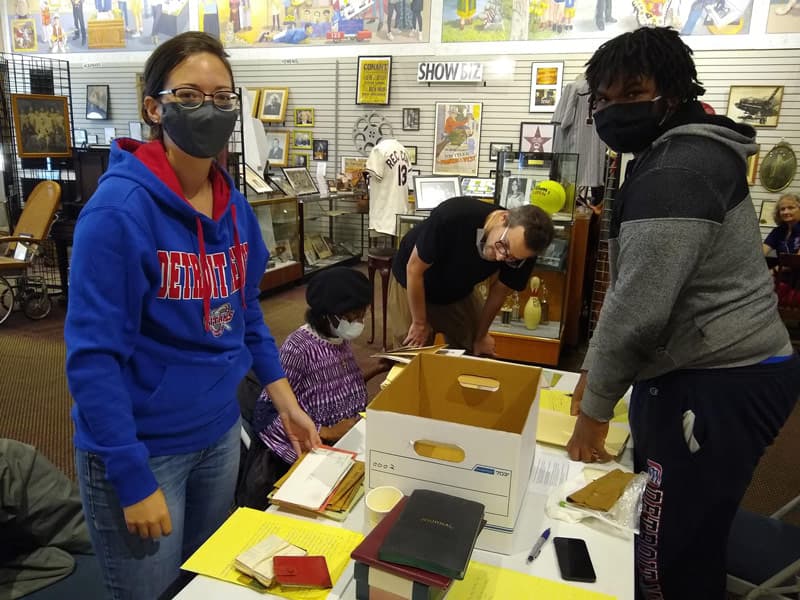 faculty and students inside the Hamtramck Historical Museum