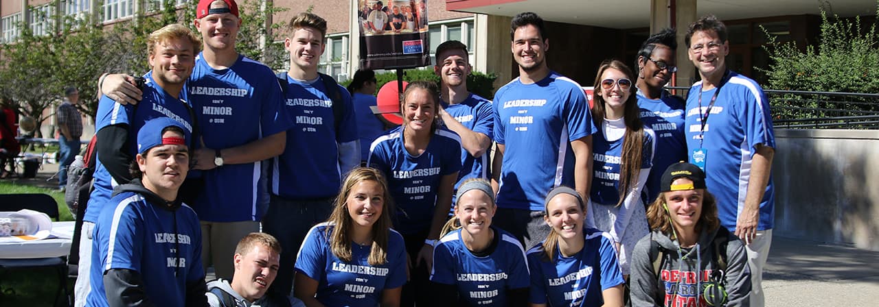 Detroit Mercy Leadership Minor Students pose for a photo outside of Briggs Building