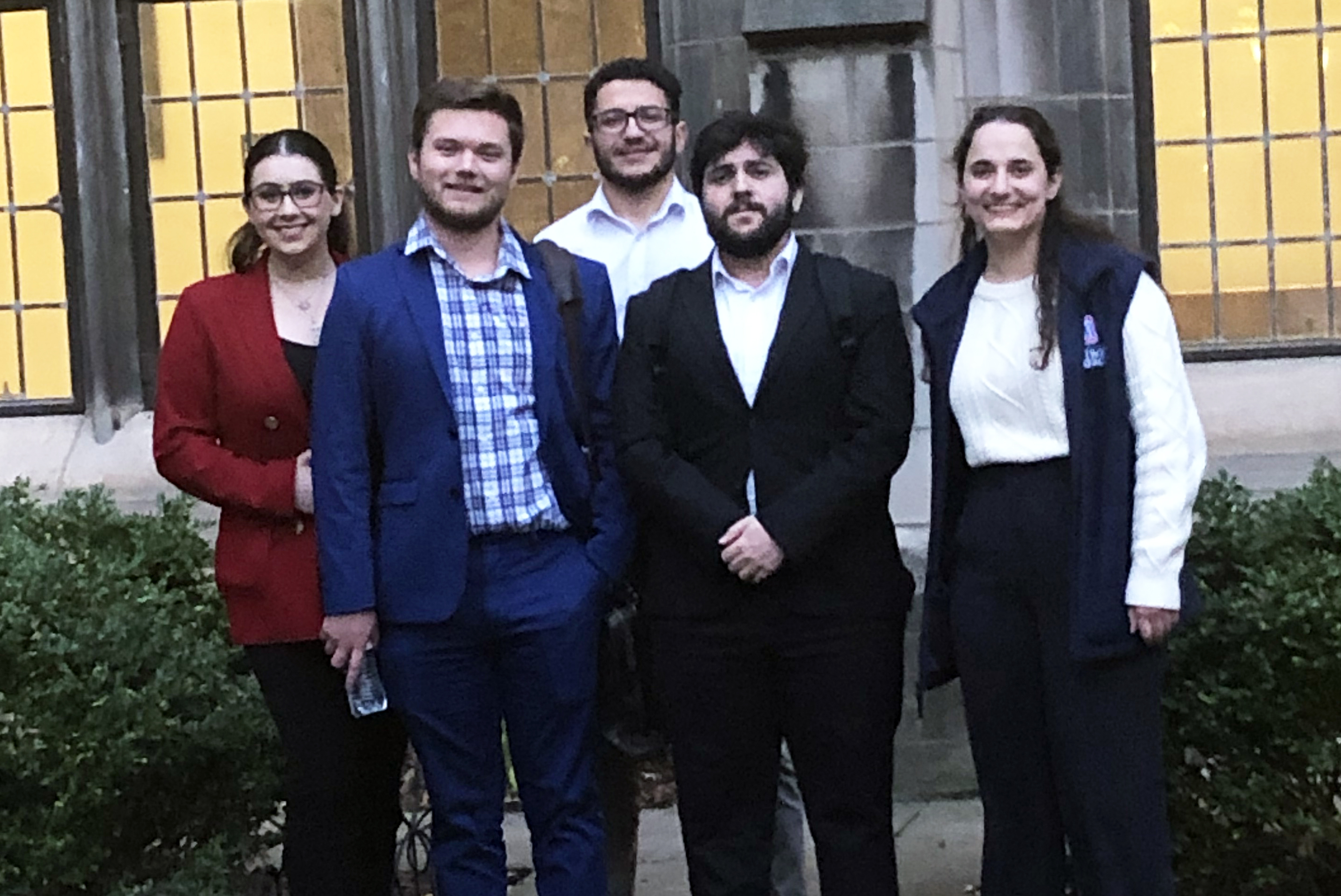 Five Ethics Bowl competitors pose for a photo outdoors in Chicago.