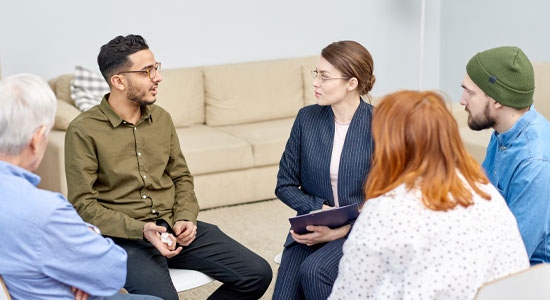 photo of people in a group engaged in conversation