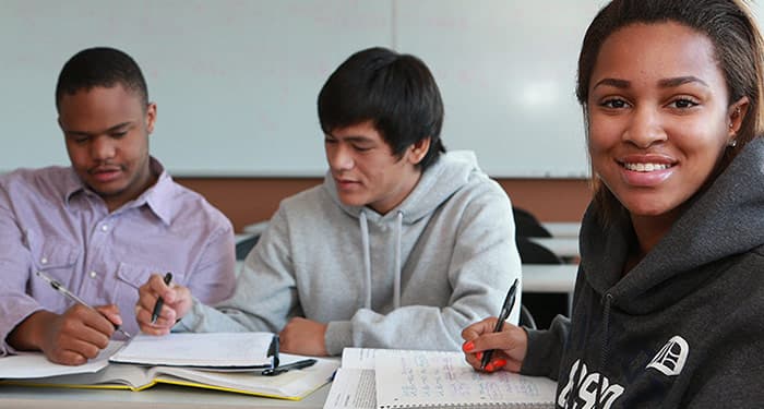 Students of multiple ethnicities smiling