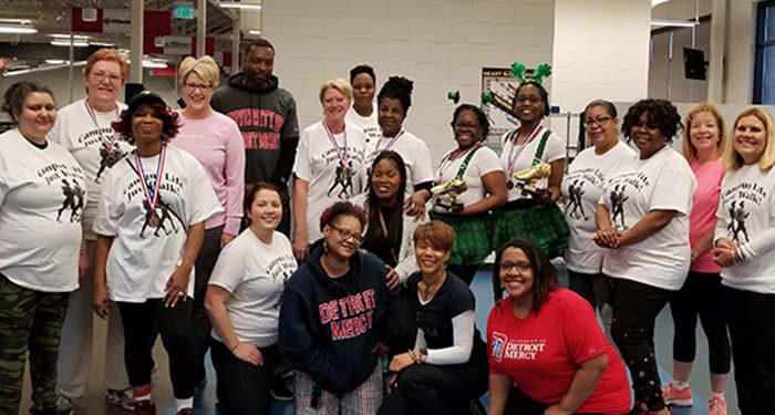 Students in a social work class smiling for the camera